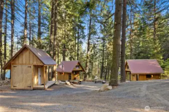 There is just so much to this Sky Meadows lot! The main gathering spot features 2 portable mini-cabins (yes, they can be moved!) and the large storage shed.