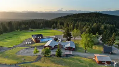 Aerial view of the Sky Meadows community lodge and infamous Stewart Mountains in the background.