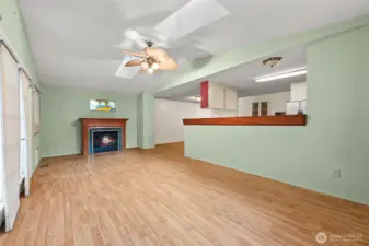 The adjacent sunroom offers additional living space with an electric fireplace and frenchdoors to the back deck.  This was an add-on by the current owner.