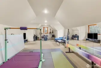 Big bonus rooms can be underwhelming, this one actually delivers. Around 26’ x 18’ and currently pulling triple duty with a gymnastics zone, gaming and TV area, and even space for a full band setup. It’s a great visual of how much this room can flex. The carpet’s been freshly cleaned, it feels ready to go, and if you’re thinking long term, this could easily become a 5th bedroom, home theater, or studio-style living space for a multigenerational vibe.