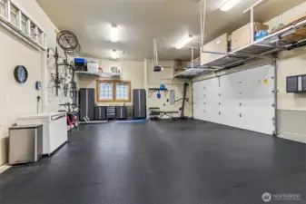 This garage is playing a little trick in the best way, the door says two car, but inside you’ve got room for three if you want to make it work. Tall ceilings open things up, and the big window brings in actual daylight so you’re not fumbling around in a cave. The tile flooring stays, which is a nice upgrade from bare concrete, and those overhead hanging shelves are already in place for all the stuff that somehow multiplies over time. Storage, projects, parking, it’s all covered here.