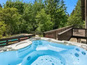 Unwind in the hot tub while enjoying a peek-a-boo view of Lake Sammamish, offering the perfect blend of relaxation and natural beauty.