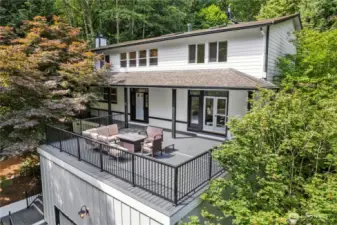 Huge front trex deck with gas BBQ line welcomes summer entertaining!