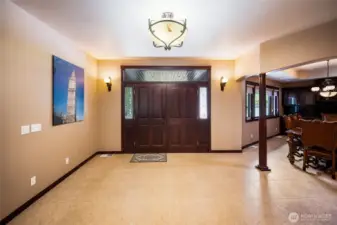 The entry is expansive, and opens to a large living room, formal dining room, & office.