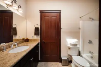 Full bathroom between the jack and jill bedrooms. The elegant style of the home consistently extends through the main level.