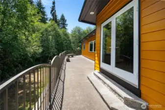 The back deck is well suited for morning coffees, summertime bbqs, or hosting a large gathering.