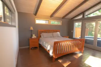 Primary Bedroom with french doors that lead to a deck