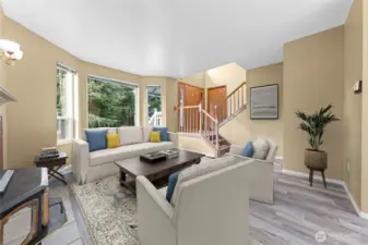 Nice and open with newer LVP flooring~This pellet stove is amazing and can heat the home too!