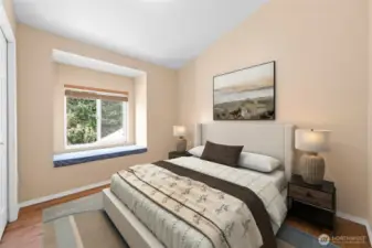 Second bedroom is so pretty with the window bench seat and vaulted ceilings~