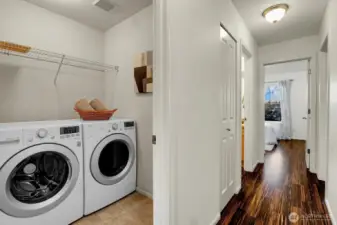 Laundry room upstairs with 3 bedrooms