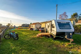 This fenced lot has power, water, sewer and internet - ready for you to make it yours.