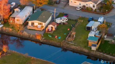 Evenings here are something special. With open western exposure across neighboring vacant lots, you’ll enjoy glowing sunset views reflecting over the water, whether relaxing by the fire pit, unwinding in an Adirondack chair, or paddling back in from an evening on the water.