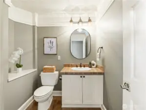 Half bath on the main floor is spacious and well-appointed
