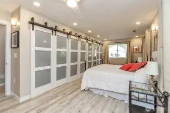 Primary with expansive cedar-line closet and hidden TV.
