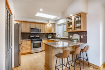 Efficient kitchen with new appliances, gorgeous granite countertops, classic glass cabinets and plenty of room for the Chef !