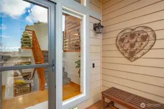 Close up view of front entrance and new glass door with sliding screen to let that fresh air in .