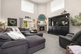 The lodge-inspired great room seamlessly connects the kitchen, living, and dining areas—creating a warm, open space perfect for gatherings and everyday living.