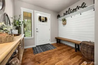 The large foyer includes a charming sitting area, blending function and style as soon as you enter