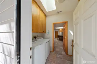 From the back door, enter into the large laundry room.