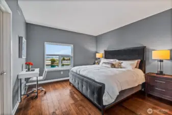 Your primary suite easiy accommodate a king-size bed.