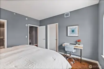 The door shown to left of the desk opens to a customized walk-in closet.