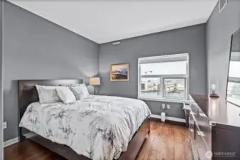 The second bedroom has plenty of space, and incudes a customized closet system as well.