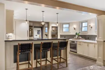 Studs out remodel on the lower level. This full kitchen was completed with quartz counters, Brizo faucet, and Sub Zero wine cabinet.