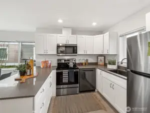Gourmet kitchen with quartz countertops and energy efficient stainless steel appliances