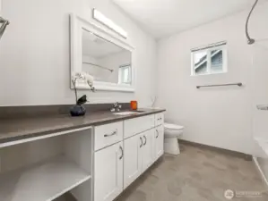 Full bathroom with quartz countertops