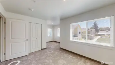 Outlook from bedroom space so you can see flexspace, closet and outlook to courtyard