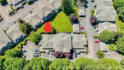 Complex & Unit view from above.  Lots of green space and trees.