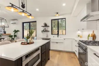Bertazzoni microwave, oven, and dishwasher. Plenty of cabinets for storage.