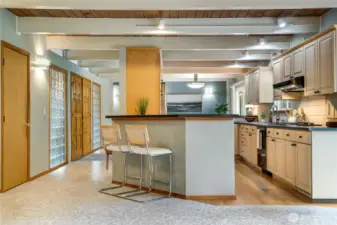 Follow the flow back to the heart of the home—an upgraded kitchen featuring custom cabinetry and thoughtfully designed lighting.