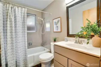 Updated hall bathroom featuring quality finishes and a bright, welcoming feel.