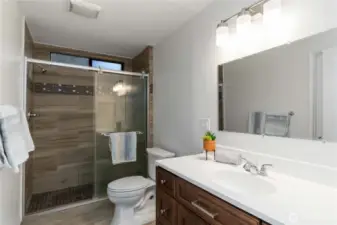 Ensuite primary bathroom with walk iin closet.