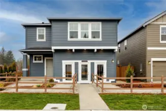 Stunning two-story home exterior. Photos are representative only and may display different color package and/or upgrades.