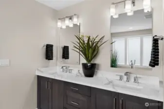 Float mounted mirrors add dimension and depth to the sleek design of the primary ensuite bathroom upstairs.