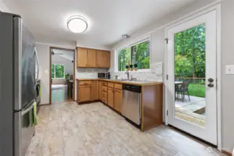 Kitchen offers lush green views and access to the wonderful deck and private yard.