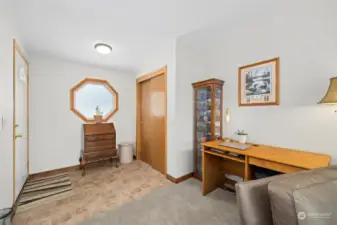 Entry way with large coat closet and pretty window.