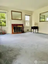The stunning fireplace wall, along with the beautiful fireplace and mantle also has two great side windows that along with the wall of windows in the front of the room help flood the livingroom with natural light