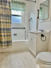 The full bathroom is between the two bedrooms and is light and bright with a window for a wonderful air flow.