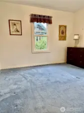 This view of Bedroom 2 of 2 shows one of the two large windows that this bedroom offers