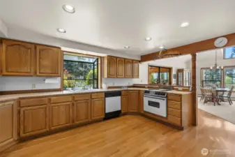 This kitchen is open and has so many cabinets!