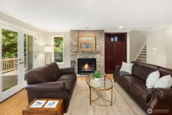A wonderfully cozy family room with built in media center, & adjacent deck for outdoor entertaining