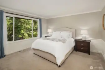 Large primary suite, very private with a forested backdrop and two walk in closets