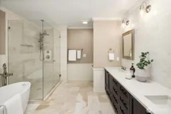 The jewel in the crown: A stunningly updated primary bathroom with marble floors and wall tile