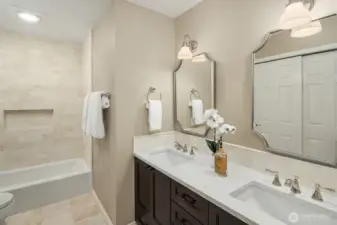 The luxury extends into the family bathroom with marble floor and wall tiles.