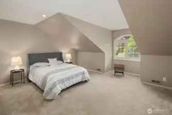 A versatile loft space - staged as a fourth bedroom - in a separate wing of home. Lovely light, closet for storage. Use as a guest room, media room, play room. You decide!