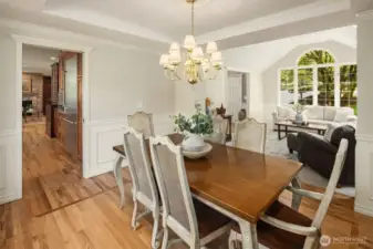 Seamlessly connected to the kitchen and a wonderful perspective overlooking mature landscaping and manicured lawn