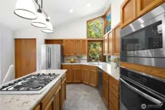 A closer look at the stunning kitchen, featuring ample counter space for those who love to cook!